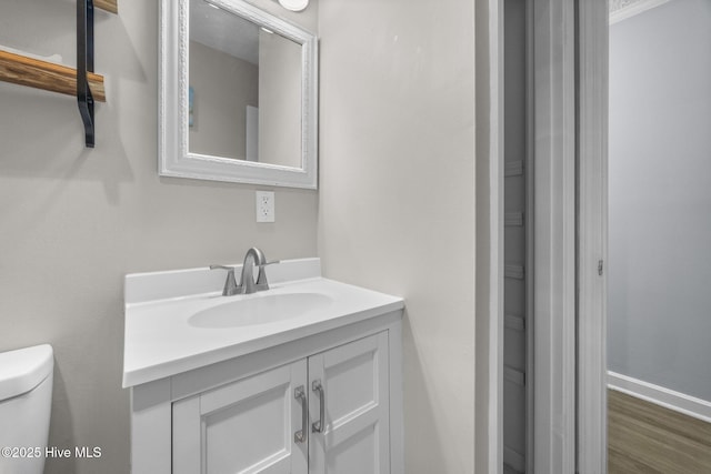 2174 New River Inlet Rd Unit 283, North Topsail Beach, NC 28460 - half bath featuring vanity, toilet, baseboards, and wood finished floors