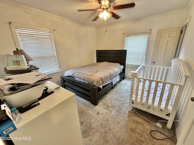 303 S Andrews Ave, Goldsboro, NC 27530 - carpeted bedroom with crown molding and a ceiling fan