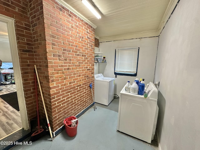 303 S Andrews Ave, Goldsboro, NC 27530 - laundry room featuring washing machine and dryer and brick wall