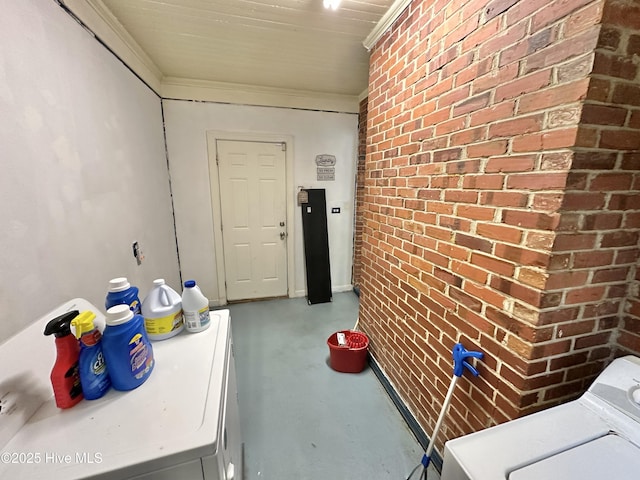 303 S Andrews Ave, Goldsboro, NC 27530 - laundry room featuring brick wall and washing machine and clothes dryer