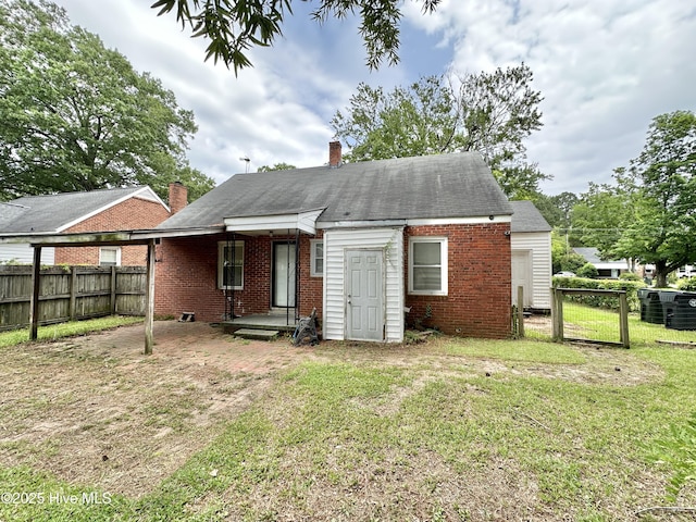 303 S Andrews Ave, Goldsboro, NC 27530 - back of property with brick siding and a chimney
