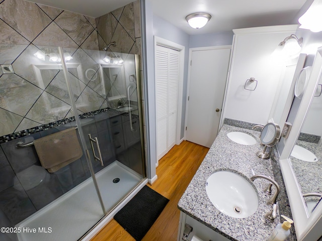1505 Salter Path Rd Unit 319, Indian Beach, NC 28512 - full bath featuring a shower stall, wood finished floors, a closet, and double vanity