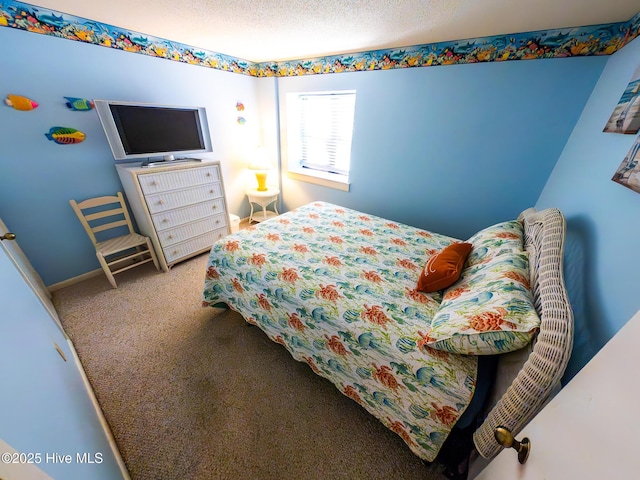 1505 Salter Path Rd Unit 319, Indian Beach, NC 28512 - carpeted bedroom with a textured ceiling