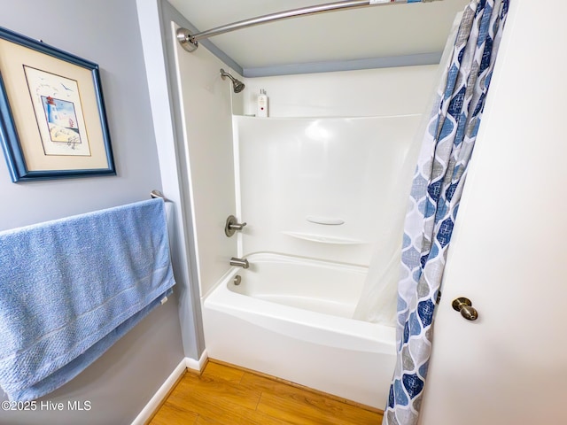 1505 Salter Path Rd Unit 319, Indian Beach, NC 28512 - full bathroom featuring wood finished floors, shower / bath combo with shower curtain, and baseboards