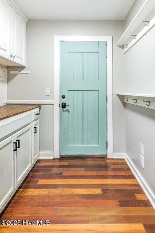 2428 Tram Rd, New Bern, NC 28562 - laundry room with dark wood finished floors and baseboards