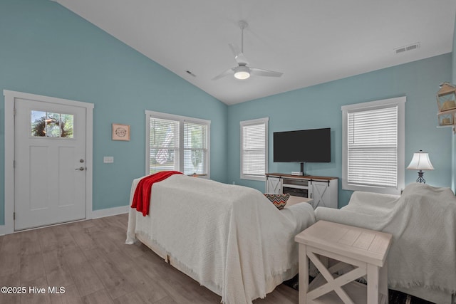 492 Jabbertown Rd, Southport, NC 28461 - bedroom with wood finished floors, lofted ceiling, baseboards, and ceiling fan