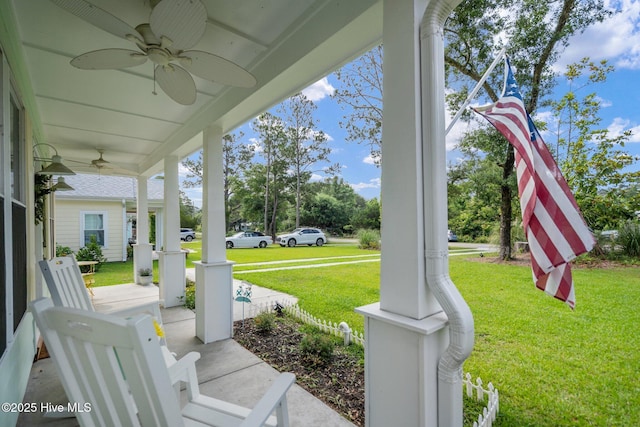 492 Jabbertown Rd, Southport, NC 28461 - porch featuring a ceiling fan and a lawn
