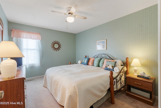 1008 Canal Dr Unit 3A, Carolina Beach, NC 28428 - bedroom featuring carpet, wallpapered walls, baseboards, and ceiling fan