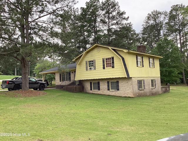 102 Hillview Cir, Rockingham, NC 28379 - view of front of property featuring a gambrel roof, brick siding, a chimney, a front lawn, and view of scattered trees