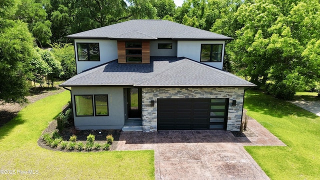 120 Fairview Rd, Leland, NC 28451 - view of front of home with roof with shingles, driveway, a front yard, a garage, and stucco siding