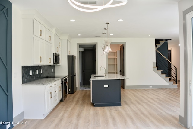 120 Fairview Rd, Leland, NC 28451 - kitchen with stainless steel microwave, electric stove, light wood-type flooring, freestanding refrigerator, and recessed lighting