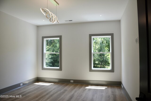 120 Fairview Rd, Leland, NC 28451 - unfurnished room with plenty of natural light, wood finished floors, baseboards, and recessed lighting