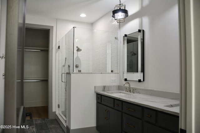 120 Fairview Rd, Leland, NC 28451 - full bathroom with a shower stall, vanity, and a walk in closet