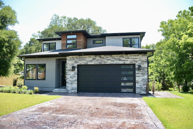 120 Fairview Rd, Leland, NC 28451 - contemporary home with concrete driveway, stone siding, a front yard, and a garage