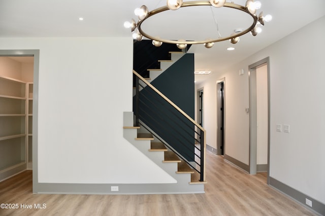 120 Fairview Rd, Leland, NC 28451 - stairs with wood finished floors, a chandelier, recessed lighting, and baseboards