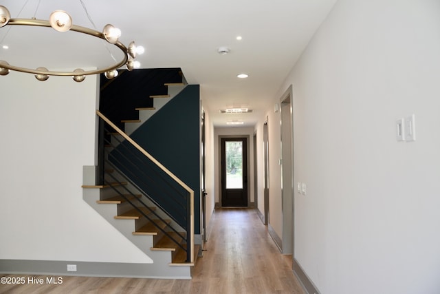 120 Fairview Rd, Leland, NC 28451 - stairway with wood finished floors, recessed lighting, and baseboards
