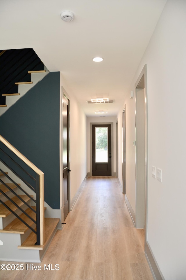 120 Fairview Rd, Leland, NC 28451 - hallway with light wood-style floors, stairs, and baseboards