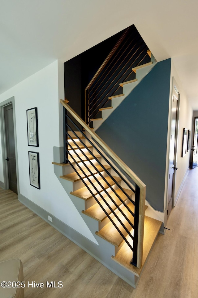 120 Fairview Rd, Leland, NC 28451 - stairs with wood finished floors and baseboards