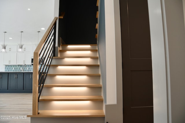 120 Fairview Rd, Leland, NC 28451 - stairway featuring wood finished floors and recessed lighting