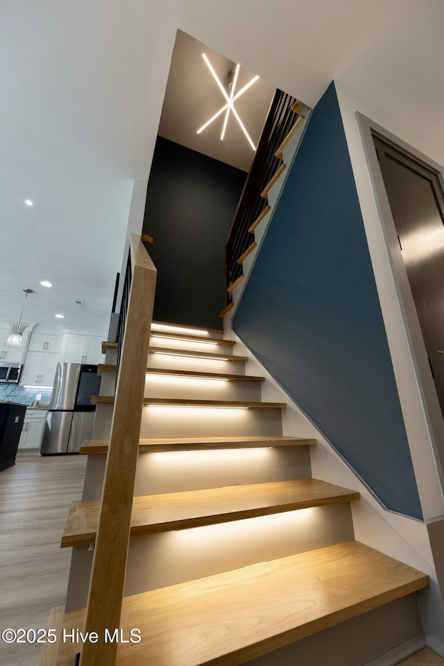 120 Fairview Rd, Leland, NC 28451 - stairway featuring wood finished floors and recessed lighting