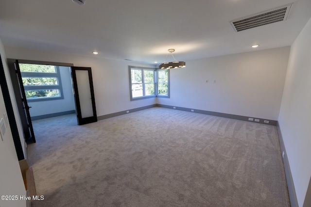 120 Fairview Rd, Leland, NC 28451 - spare room featuring carpet flooring, baseboards, a chandelier, and recessed lighting