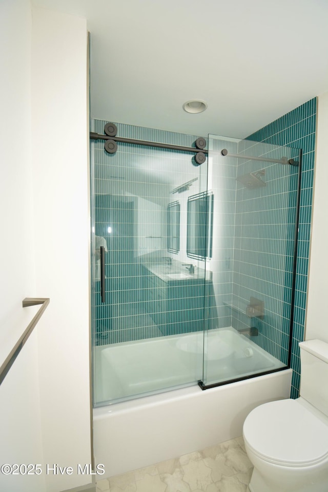 120 Fairview Rd, Leland, NC 28451 - bathroom featuring marble finish floors, combined bath / shower with glass door, and toilet