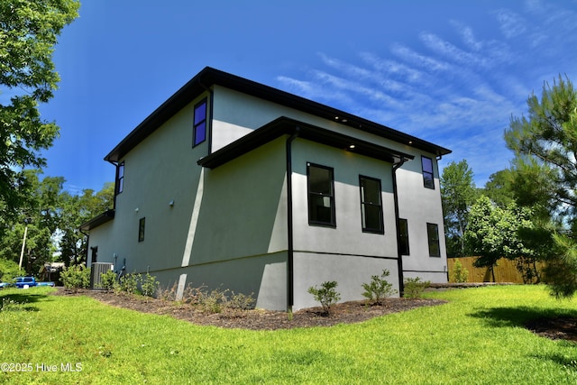 120 Fairview Rd, Leland, NC 28451 - view of side of home featuring stucco siding and central air condition unit