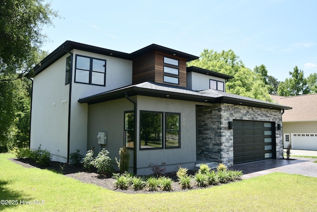 120 Fairview Rd, Leland, NC 28451 - contemporary home featuring driveway, stucco siding, an attached garage, and a front yard