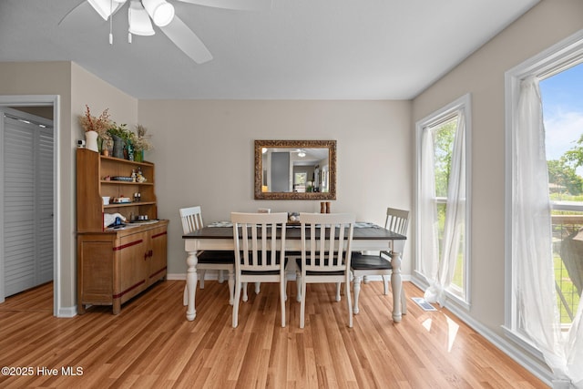 6008 Cassowary Ln, New Bern, NC 28560 - dining area featuring light wood-style flooring, a ceiling fan, and baseboards