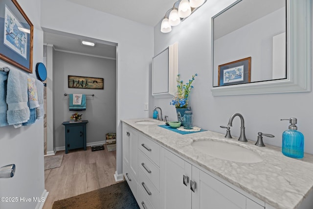 6008 Cassowary Ln, New Bern, NC 28560 - full bath with double vanity, wood finished floors, and baseboards