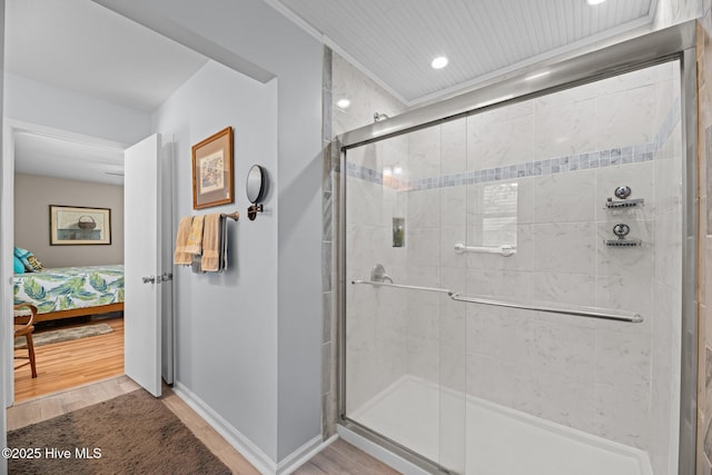 6008 Cassowary Ln, New Bern, NC 28560 - full bathroom featuring connected bathroom, wood finished floors, a shower stall, baseboards, and recessed lighting