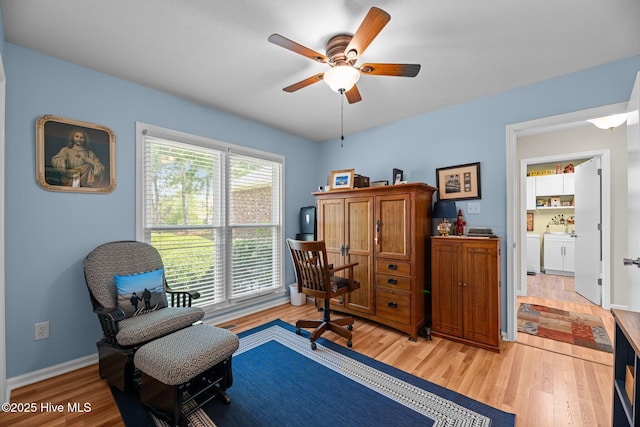 6008 Cassowary Ln, New Bern, NC 28560 - living area featuring light wood finished floors, a ceiling fan, and baseboards