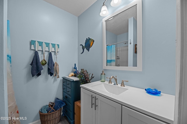 6008 Cassowary Ln, New Bern, NC 28560 - bathroom featuring vanity, a textured ceiling, and a shower with shower curtain