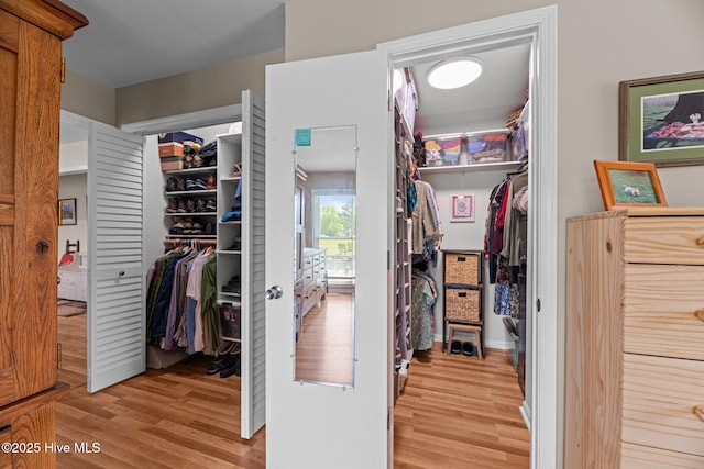 6008 Cassowary Ln, New Bern, NC 28560 - walk in closet featuring light wood-style floors