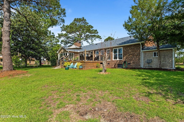 6008 Cassowary Ln, New Bern, NC 28560 - back of house featuring a yard, a chimney, and a deck