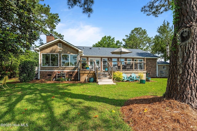 6008 Cassowary Ln, New Bern, NC 28560 - rear view of house with a lawn, a chimney, and a deck