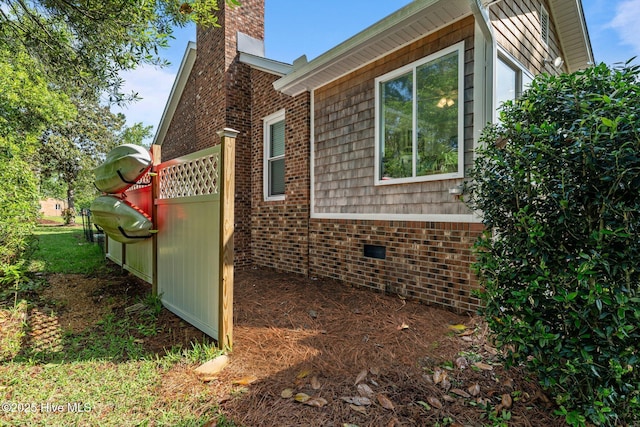 6008 Cassowary Ln, New Bern, NC 28560 - view of side of home with a chimney, brick siding, and crawl space