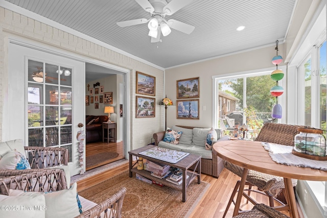6008 Cassowary Ln, New Bern, NC 28560 - living area with light wood-style flooring, crown molding, and a ceiling fan