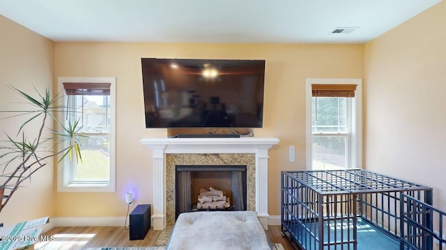 44 Nassau Ct, Clayton, NC 27520 - living area with wood finished floors, healthy amount of natural light, and baseboards