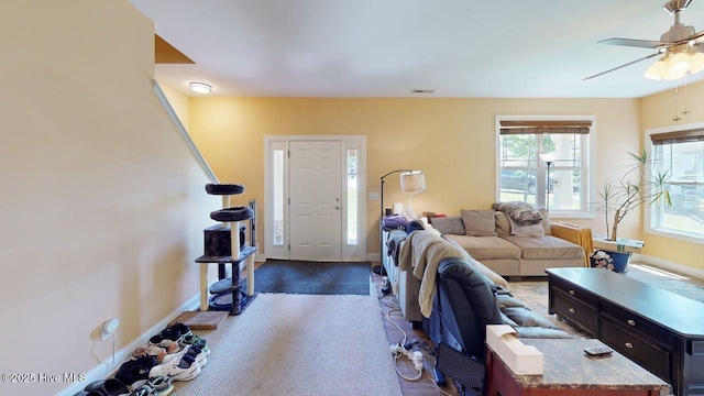 44 Nassau Ct, Clayton, NC 27520 - carpeted living room with a ceiling fan and baseboards