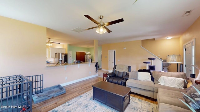 44 Nassau Ct, Clayton, NC 27520 - living area with a ceiling fan, light wood-style flooring, and baseboards