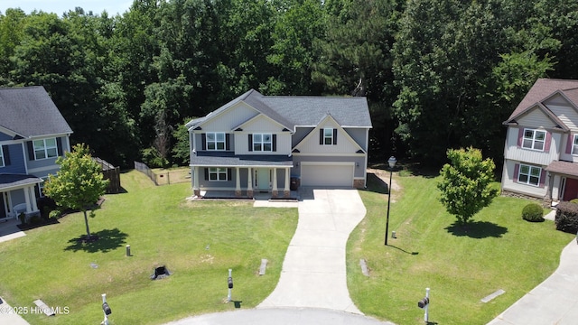 44 Nassau Ct, Clayton, NC 27520 - view of front facade with driveway, a porch, an attached garage, a front lawn, and a shingled roof