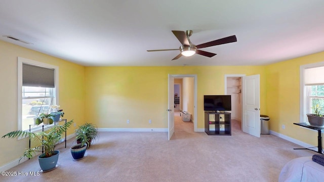 44 Nassau Ct, Clayton, NC 27520 - living room featuring light carpet, ceiling fan, and baseboards