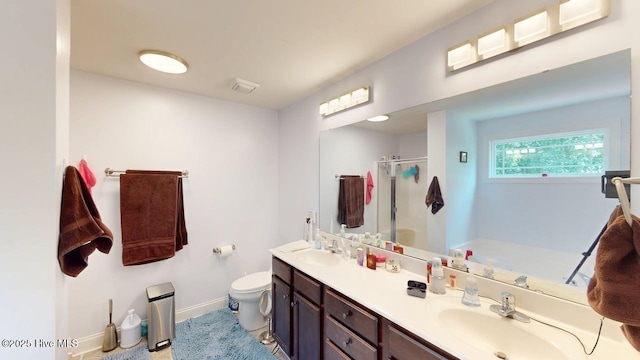 44 Nassau Ct, Clayton, NC 27520 - full bathroom featuring a stall shower, double vanity, toilet, baseboards, and a tub