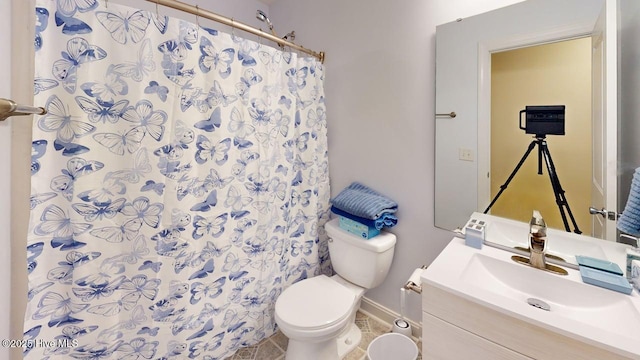 44 Nassau Ct, Clayton, NC 27520 - bathroom featuring toilet, vanity, a shower with shower curtain, and baseboards
