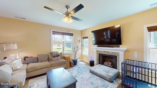 44 Nassau Ct, Clayton, NC 27520 - living area with a ceiling fan, a fireplace, wood finished floors, and baseboards