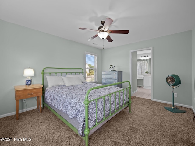 120 Buds Ln, Cedar Point, NC 28584 - carpeted bedroom featuring baseboards, a ceiling fan, and connected bathroom