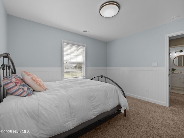 120 Buds Ln, Cedar Point, NC 28584 - bedroom with a wainscoted wall and carpet floors