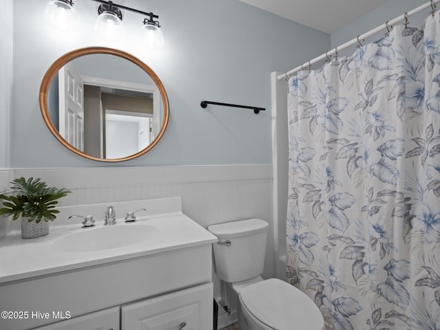 120 Buds Ln, Cedar Point, NC 28584 - bathroom featuring vanity, a wainscoted wall, toilet, and a shower with shower curtain