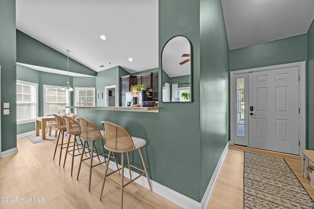 211 Bill Canady Rd, Sneads Ferry, NC 28460 - foyer entrance featuring high vaulted ceiling, baseboards, light wood-type flooring, a chandelier, and recessed lighting